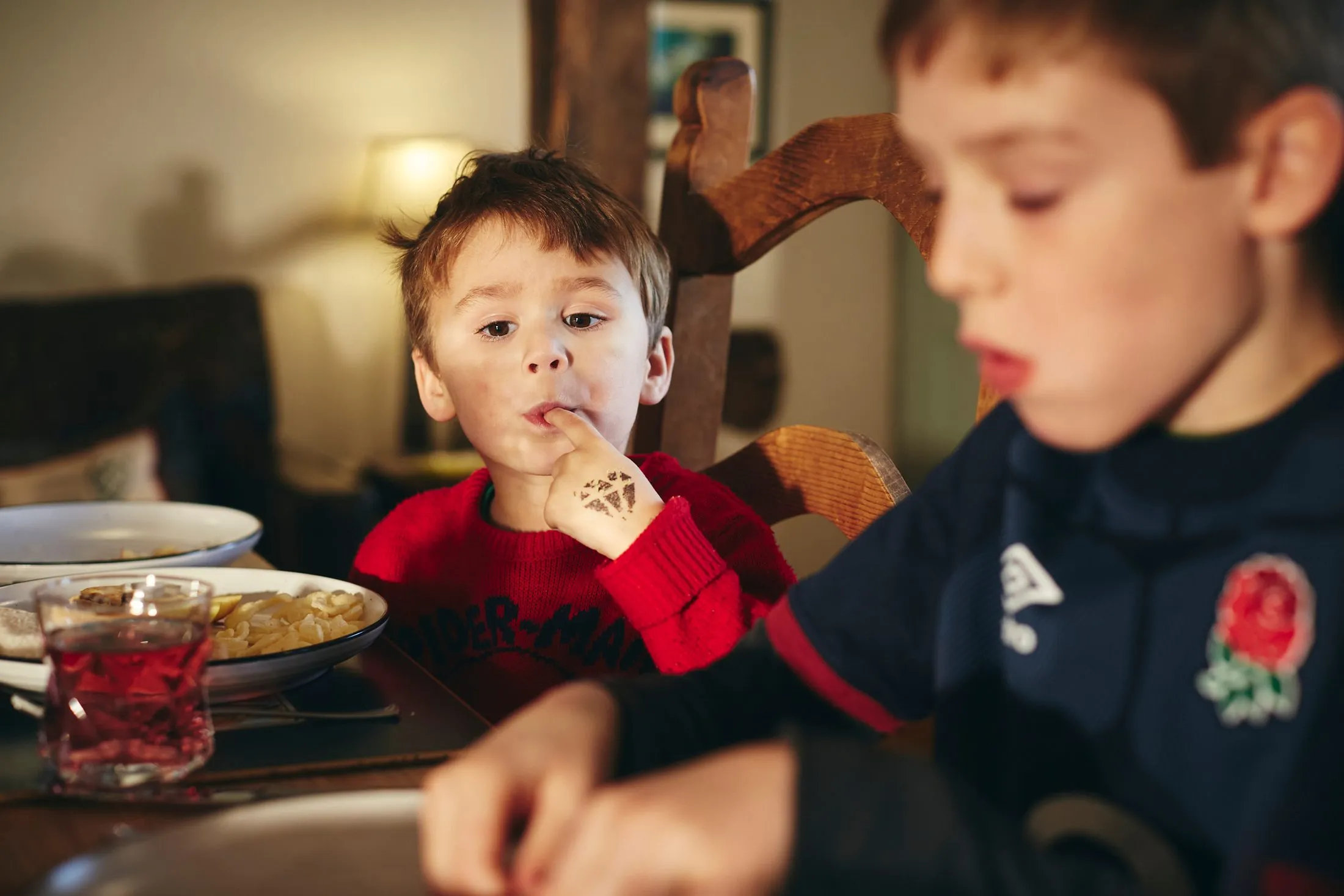 Child Eating Crisps Family Kitchen
