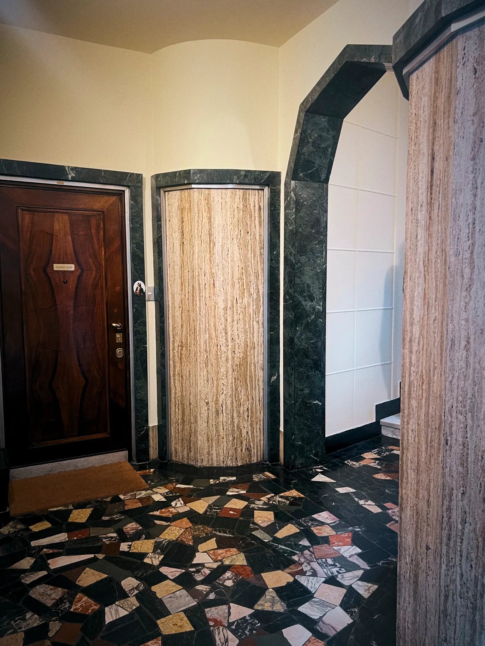 Marble and terrazzo entrance hall of the Milano location apartment used for the Oreo shoot.